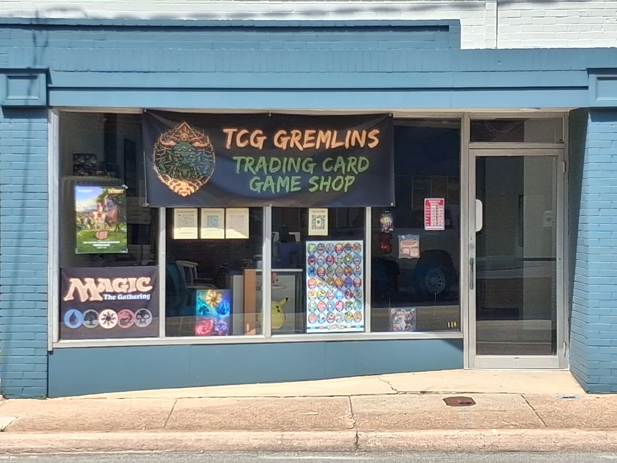 The blue storefront of TCG Gremlins on West Third Street